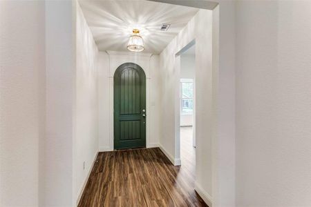 Entryway with dark hardwood / wood-style floors