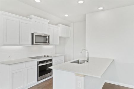 Kitchen in the Nobel home plan by Trophy Signature Homes – REPRESENTATIVE PHOTO