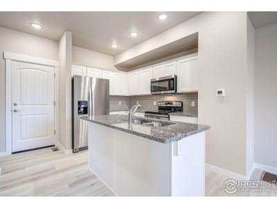 New construction Townhouse house 1721 Westward Cir, Unit 2, Eaton, CO 80615 - photo 0