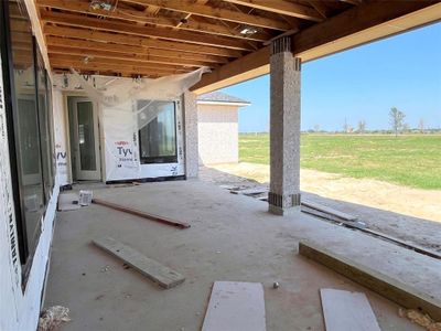 Spacious covered patio with views of the giant back yard.