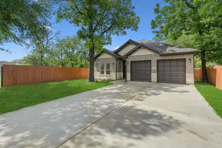 Spacious drive way and two-car garage.