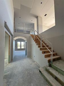 Entry/Foyer with show stopping soaring ceilings and grand staircase