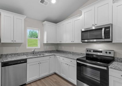 Kitchen with stainless steel appliances.