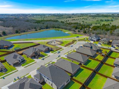 Drone / aerial view with a water view and a residential view.