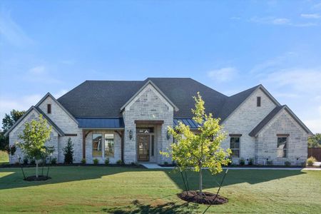 French country style house with a front lawn