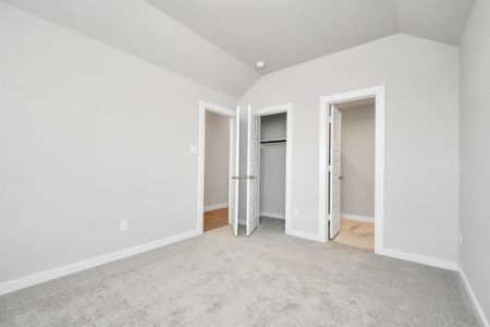 Another view of the guest suite, situated at the front of the home. Sample photo of completed home with similar floor plan. As-built interior colors and selections may vary.