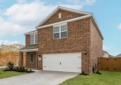 This home has a 2-car garage and gorgeous stone detailing.