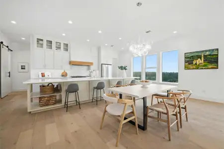 Featuring a luminous open floor plan floor the living room, gourmet island kitchen, and formal dining area with soaring high ceilings, LED recessed lighting, and refined contemporary finishes that are sure to impress.