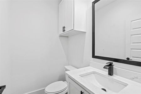 Bathroom with vanity and toilet