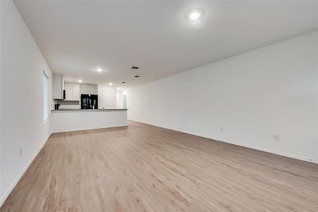 Unfurnished living room with light wood-type flooring