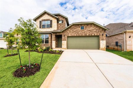 Front yard, Live Oaks, Flower bed, two car garage