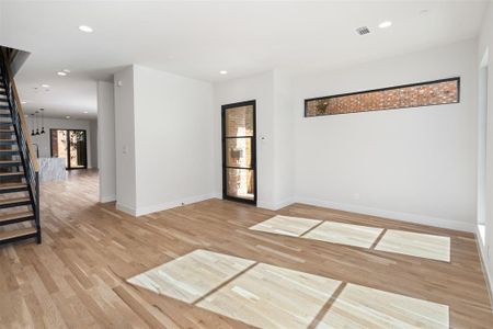 Empty room with light hardwood / wood-style floors