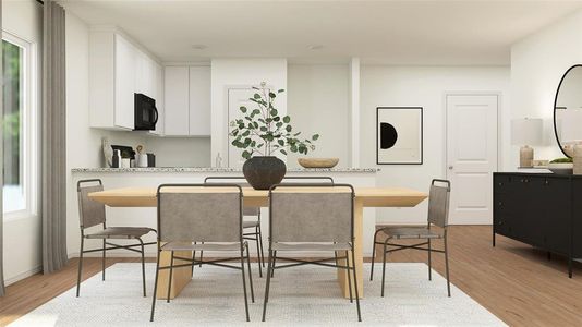 Dining area with light hardwood / wood-style floors and plenty of natural light