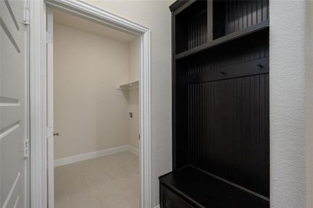 Mudroom featuring light tile patterned floors