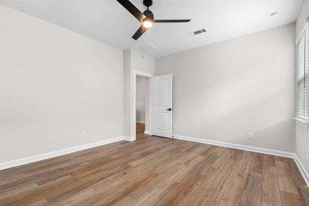 The primary bedroom with vinyl plank flooring continued into the space.