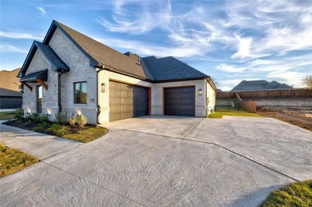 View of side of property featuring a garage