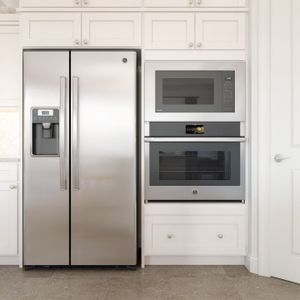 Brushed satin nickel hardware & Brellin white cabinets