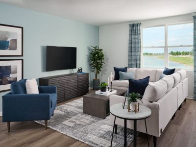 Living room in the Hibiscus floorplan modeled at The Reserve at Twin Lakes