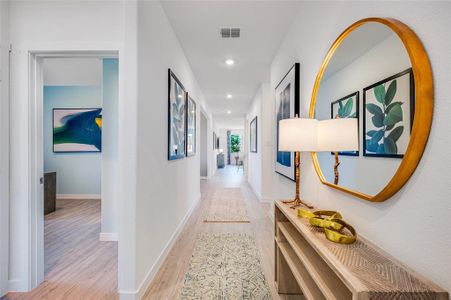 Hallway featuring light hardwood / wood-style flooring