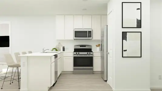 Kitchen featuring stainless steel appliances, kitchen peninsula, sink, white cabinetry, and light wood-type flooring