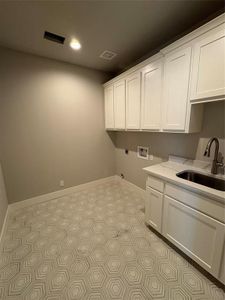 Laundry room with sink