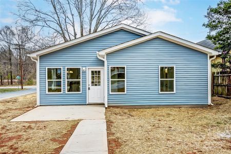 Backyard w/ Back Patio, Walkway, and Driveway