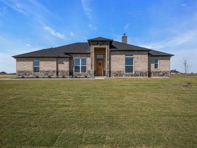 Prairie-style home featuring a front yard