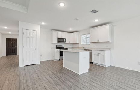 Expansive kitchen with oversized island *Real home pictured