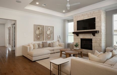 Gathering Room with Tray Ceiling and Fireplace