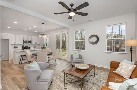 Vinyl plank flooring throughout first floor. Representative Photo