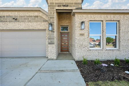 Property entrance featuring a garage