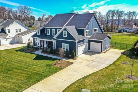 3 car garage with entry doors to the home in both bays