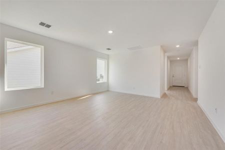 Empty room with light wood-type flooring