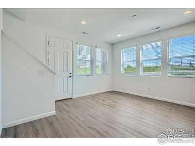 Lots of windows and elegant laminate floors.