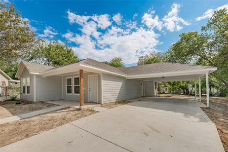 Ranch-style home featuring a carport