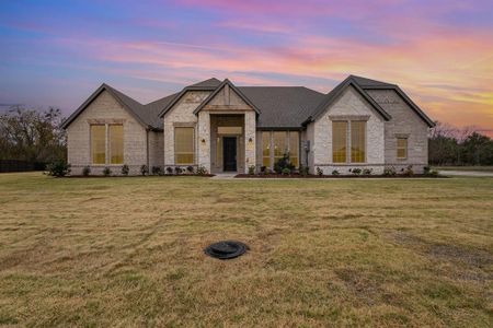 French provincial home featuring a yard