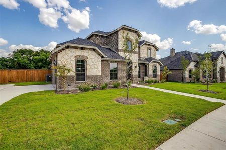 View of front of property with a front yard