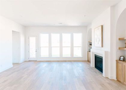 Unfurnished living room featuring light hardwood / wood-style flooring