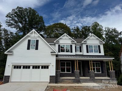 Homesite 28 features a Charleston D floorplan with front-load garage.