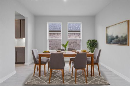 You and your guests will certainly dine in style in this amazing formal dining room! Featuring large windows with blinds, neutral paint, high ceilings, and tile flooring! Perfect space to entertain family and friends!