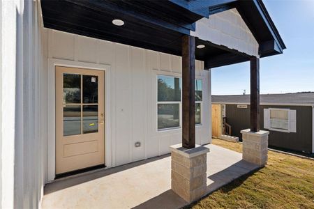 Front entry with covered front porch.