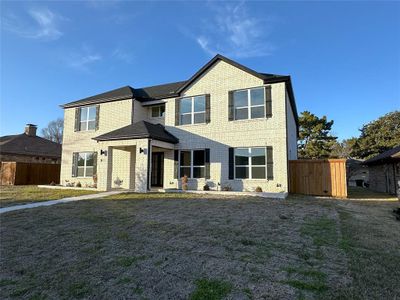 View of front of property with a front yard