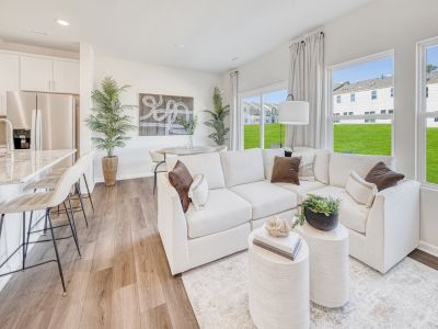 Great room in the Topaz floorplan at a Meritage Homes community in Graham, NC.