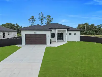 New construction Single-Family house 710 Almelia St E, Lehigh Acres, FL 33974 - image