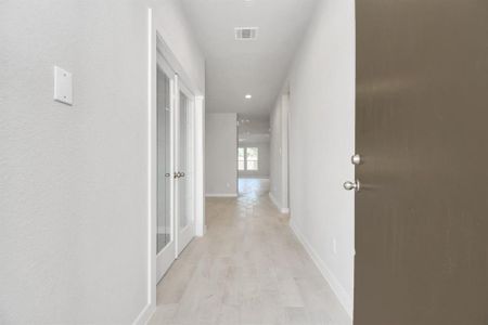 As you step into the threshold of this luxurious home, you'll soon be welcomed by an elegant glass door (to be installed). Inside, soaring ceilings amplify the spaciousness, while the refined wood-look tile flooring and oversized baseboards exude sophistication and charm.