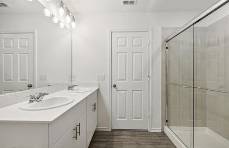 Elegant owner's bathroom with oversized shower*real home pictured