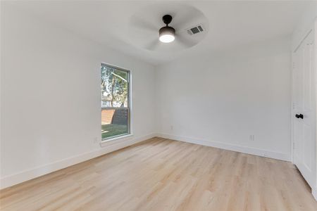 Unfurnished room featuring light hardwood / wood-style floors and ceiling fan