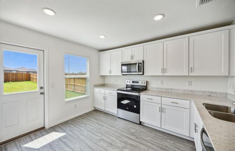 Spacious kitchen with ample cabinet space *real home pictured