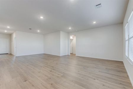 Unfurnished room with light hardwood / wood-style floors