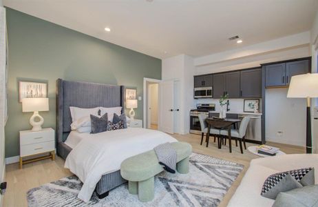 First level bedroom is its own studio apartment that features a private laundry closet, full sized gas stove, vented microwave, full-sized sink, full-sized dish washer and a fridge connection.